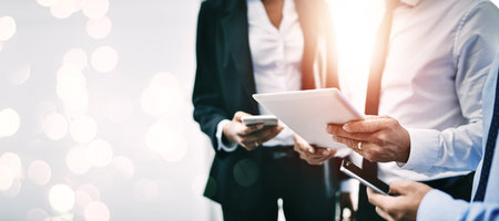 Hands, technology and double exposure with business people together for communication or networking closeup on space. Collaboration, tablet and phone with a professional employee team working onlineの写真素材