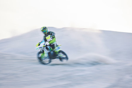 Blur, fast motorbike and man in desert for sports, action adventure or extreme travel on dirt on mockup space. Off road, sand and driver on motorcycle for speed in nature, competition race or freedomの写真素材