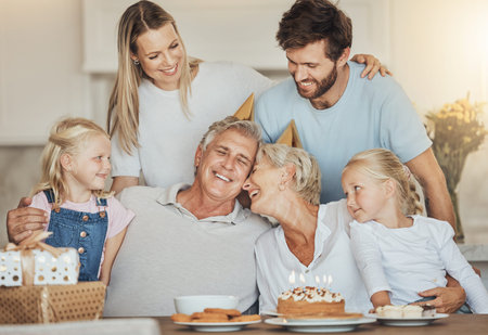 Birthday, family and grandparents and kids with cake for party, celebration and festive event in...