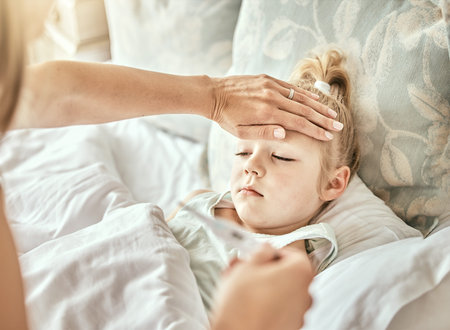 Parent, hands and thermometer with sick kid, fever or flu virus in bed from cold at home. Closeup of...