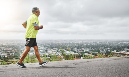 Senior man, running and fitness on mountain for outdoor exercise, training or workout on mockup....