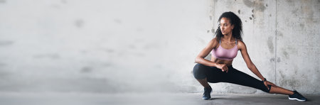 Banner, mockup space and woman with fitness doing exercise or workout for wellness and health by wall. Athlete, ready and strong person prepare for training or stretching leg muscle for body balanceの写真素材