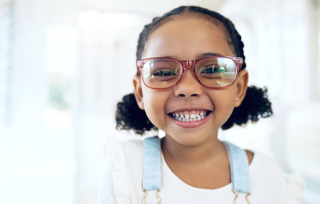 Store portrait, happy child and vision eyeglasses, lens frame or optical eyewear for youth ocular wellness, support or optometry. Retail product, visual accessory and young kid for eye care glassesの写真素材