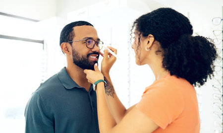 Man, woman optometrist and glasses fitting in store with prescription, eye care and healthy vision....