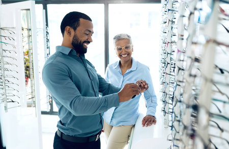 Optometry, glasses and woman with patient for option, choice and eye care option in optician store....