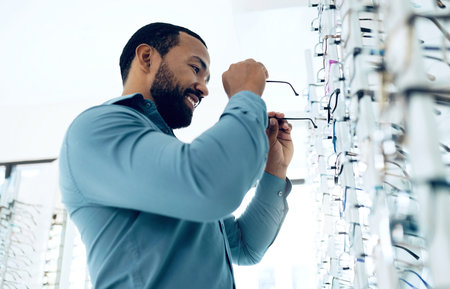 Optometry, vision and happy man with glasses for decision, choice and eye care option in optician...