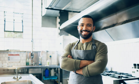 Happy man, chef and small business owner at restaurant for hospitality service, cooking or food in...