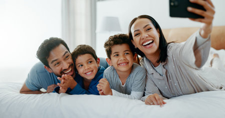 Family selfie, laughing and in a home bedroom for a memory, happy and comedy together. Smile, love...