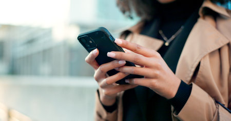 Hands, phone or woman in city to chat on social media, internet post or website notification. News info, blog update or closeup of entrepreneur texting, networking or typing online on mobile appの写真素材