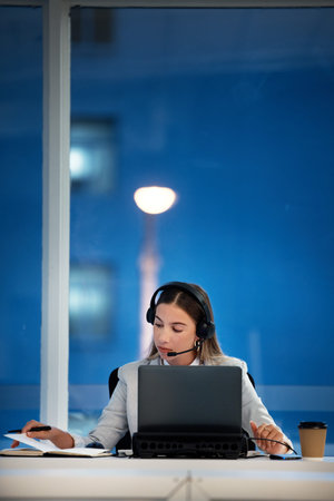 Business woman, notebook and call center communication, planning and night advice, support or...
