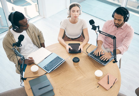 Radio, technology or broadcast with a content creator team in the office from above for streaming or...