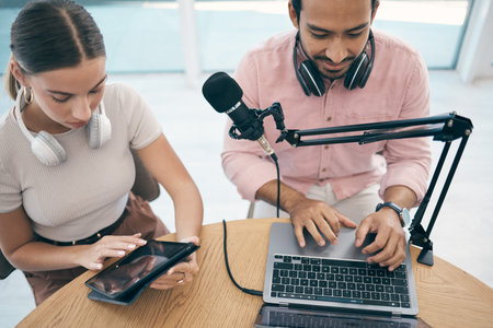 Radio presenter, technology and teamwork for podcast, content creation and planning with laptop or...