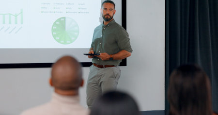 Finance, presentation and a business man coaching a workshop in the conference room of a workplace....