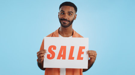 Studio sales poster, happy man and surprise ads commercial, discount promotion banner or notification sign. Billboard info, placard and ambassador presentation, choice or deal on blue backgroundの写真素材