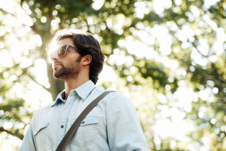 Relax, thinking or man in park walking in summer for fresh air, holiday vacation or break in garden...