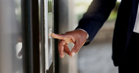 Elevator button, man and business worker at corporate building and lift for office floor. Company, person and financial employee ready for professional job and staff working at a workplace for careerの写真素材