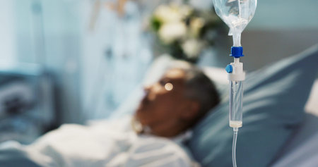 IV drip, healthcare and medicine with patient in hospital, treatment and surgery, healing or...