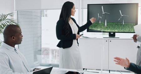 Business woman, windmill presentation and screen in office for innovation, energy and sustainable...