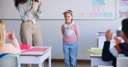 Class, presentation success and child speaker with applause and cheering in classroom at school....