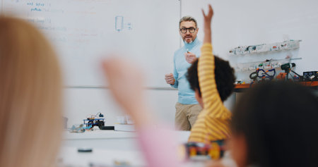 Science, raised hand and teacher with child in classroom for research on a project in school....