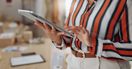 Business woman, hands and tablet in research, networking or social media for logistics at boutique....