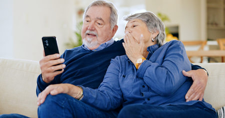 Home, internet and senior couple with cellphone, love and connection with social media, talking and...
