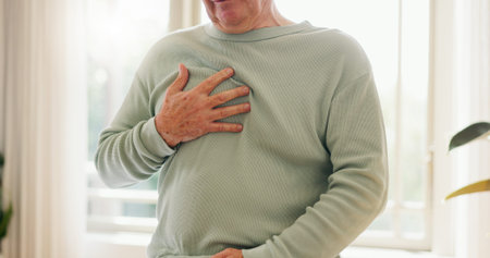 Heart attack, cardiology and person holding chest with pain, sick and cardiovascular healthcare....
