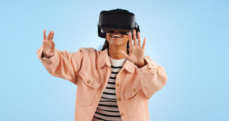 Virtual reality, hands on screen and woman with future technology and smile in studio on blue...