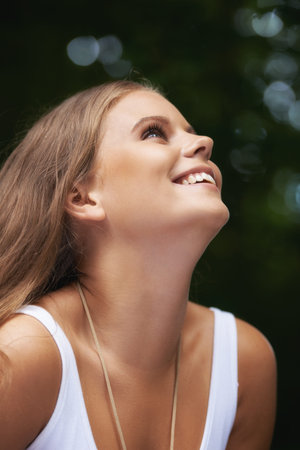 Woman, smile and profile in nature for happiness, healing and freedom in outdoors, hope and relax....