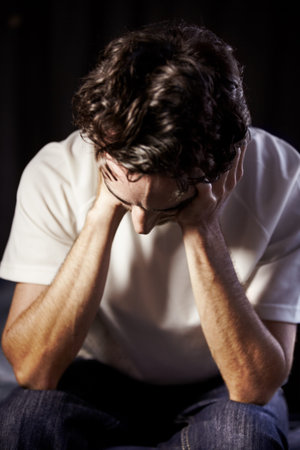 Man, headache and depression, mental health and brain fog, massage temple for pain, grief and...