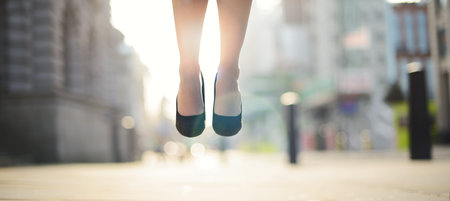 Business has never been better. a businesswoman jumping in the air.