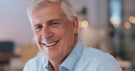 Mature, lawyer and happy portrait in office of law firm working overtime at night on legal project. Senior, partner and ceo of attorney consultancy company with happiness of face for court caseの写真素材