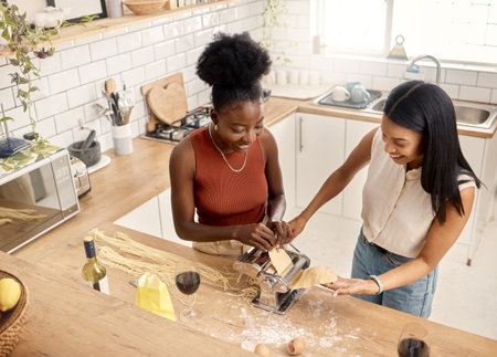 Life is what you bake of it. two young friends cooking together at home.