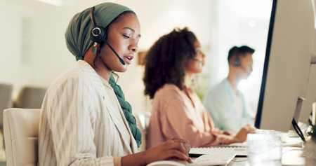 Telemarketing, black woman and contact us worker on a consultation at call center with computer. Consultant, employee and discussion of office and agency communication with customer support on webの写真素材