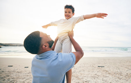 Happy, father and son playing, beach and summer holiday with happiness, travel and bonding. Portrait, dad and male child on a seaside vacation, quality time and fun on a break, activity and smileの写真素材
