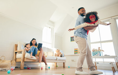 Superhero flight, dad and happy kid play crime fighting game, imagine flying and enjoy time together, fun and bonding. Comic character, creative Halloween costume and family father and child playingの写真素材