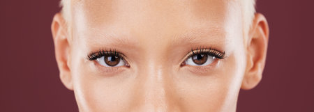 Portrait, woman eyes and beauty makeup with mascara and eyebrows bleached in a studio. Cosmetics,...