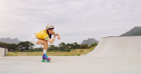 Roller skate, extreme sports and woman riding fast with speed in a skate park with mockup space...