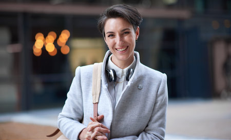 Smile, portrait and business woman in city with vision, mission and success mindset. Ceo, boss and happy, proud and confident female entrepreneur from Canada ready for goals in urban street outdoors.の写真素材