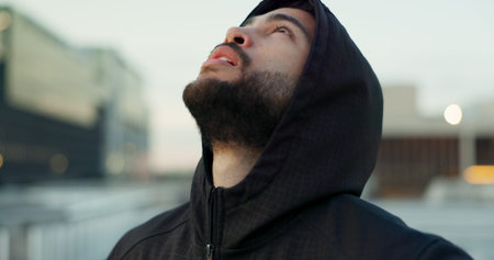 Thinking, fitness and man in city for rest, break and breathe after running, workout and exercise....