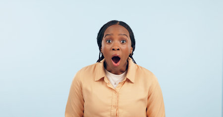 Portrait, black woman and surprised in studio, shocked or wow emoji for gossip, drama or...