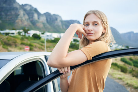 Young woman, travel and with car on vacation, journey and adventure for summer. Independent female, confident girl and taking break from road trip driving for holiday, relax getaway and happy outdoorの写真素材