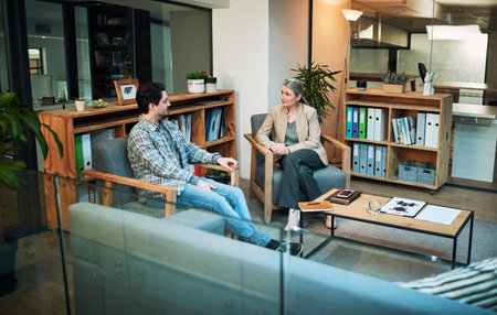 Nothing heals quite like communication. a young man having a therapeutic session with a psychologist.の写真素材