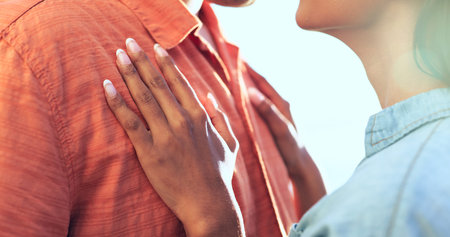 Couple, hands and date on holiday with love, support and travel with marriage and vacation. Summer, adventure and calm outdoor with a woman and man together with hope, touch and trust embraceの写真素材