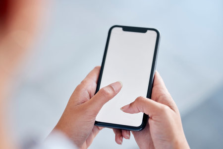 Closeup shot of an empty cellphone screen. Unknown female working texting while using. a phone to...