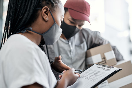 Nothing satisfies a customer like same day delivery. a masked young woman signing for a delivery...