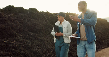 Team, farmer and compost or business talking for agriculture company, plant growth or paperwork. Man, woman and document for sustainable environment or land development for inspection, garden or soilの写真素材