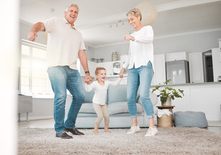 Go home and love your family. an adorable little girl bonding with her grandparents while dancing...