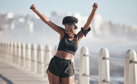 Happy woman, dance and fitness success by city beach in energy, exercise and cardio health with...