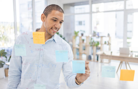 Writing, planning and businessman in office for schedule, agenda and management with sticky notes....